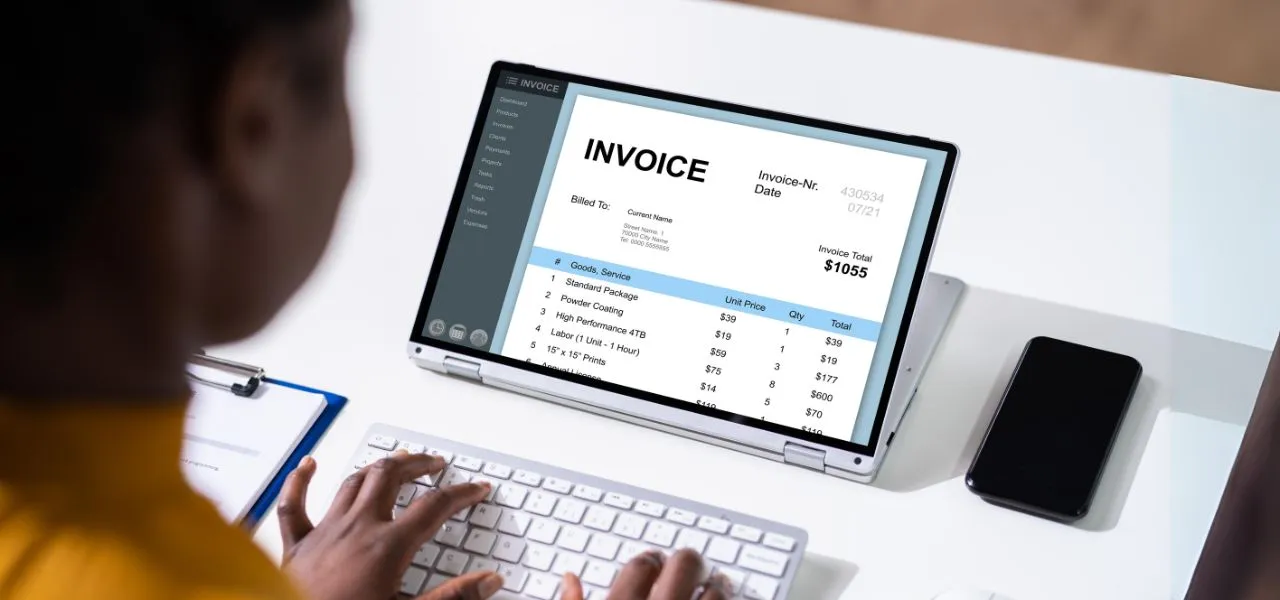 Showing VAT Invoice on Laptop